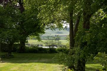 Wonderful views from the private garden through a copse and across the valley.