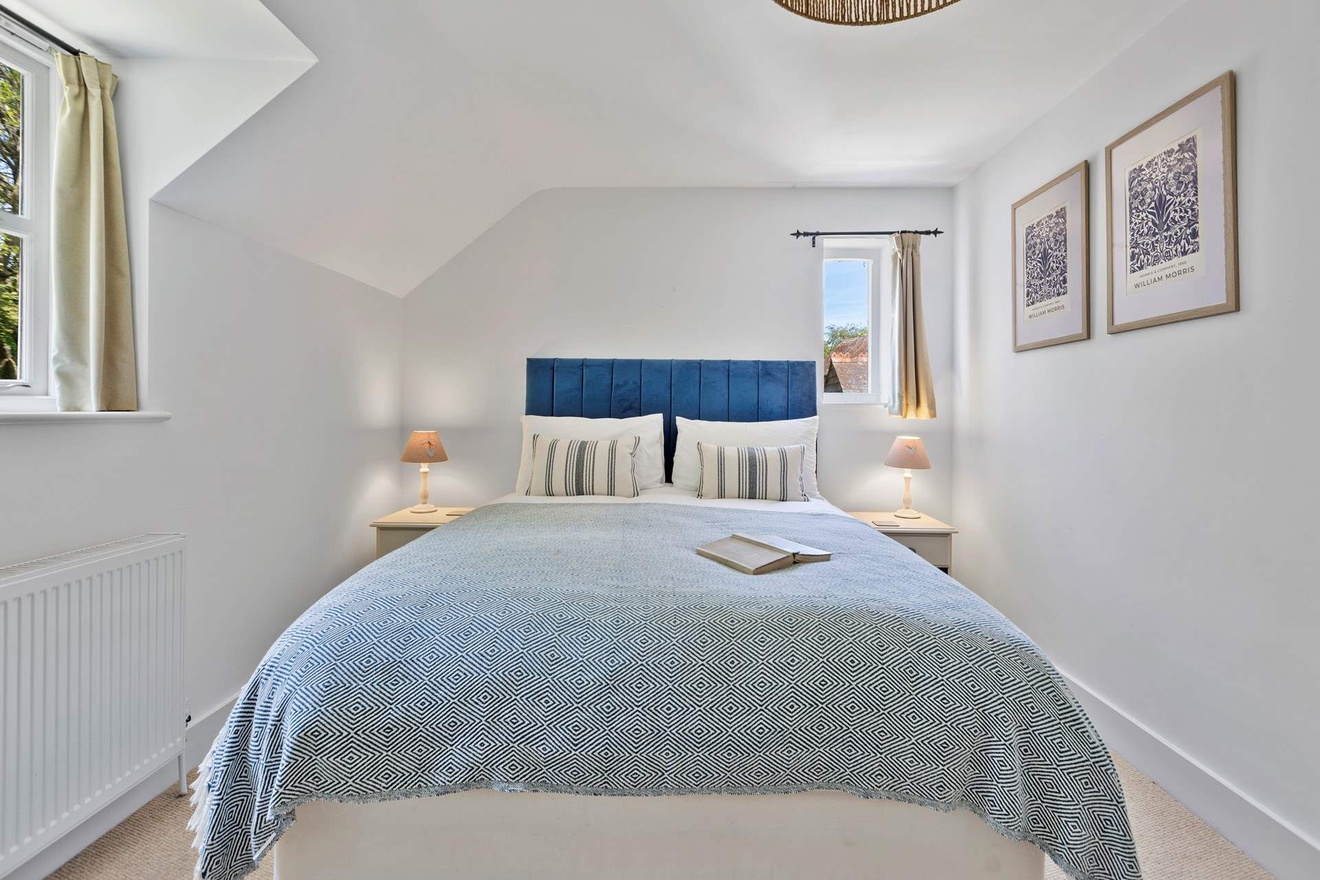 Upstairs, the sumptuous primary bedroom features a king size bed and en-suite bathroom.