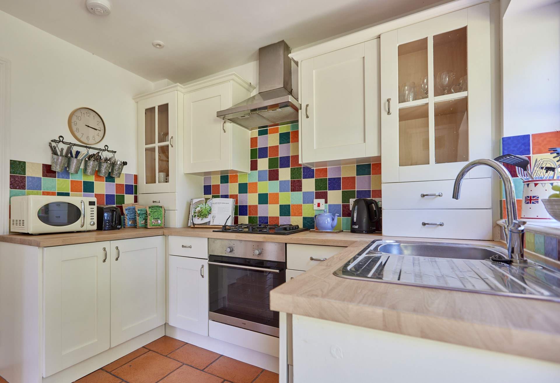 The pretty kitchen is off the sitting room and overlooking the garden.