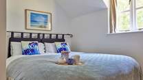 Bedroom 2 has a lovely view over the garden and features a 'zip and link' king-size bed that can be split into two singles to suit.
