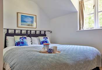 Bedroom 2 has a lovely view over the garden and features a 'zip and link' king-size bed that can be split into two singles to suit.