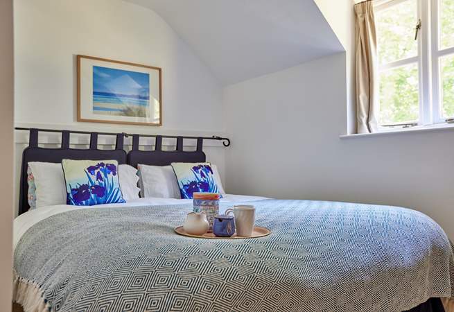 Bedroom 2 has a lovely view over the garden and features a 'zip and link' king-size bed that can be split into two singles to suit.