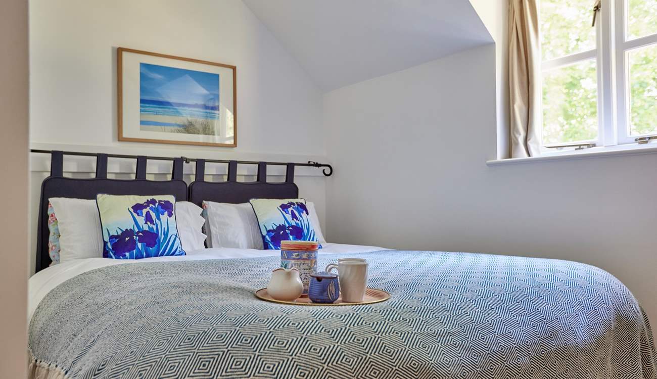 Bedroom 2 has a lovely view over the garden and features a 'zip and link' king-size bed that can be split into two singles to suit.