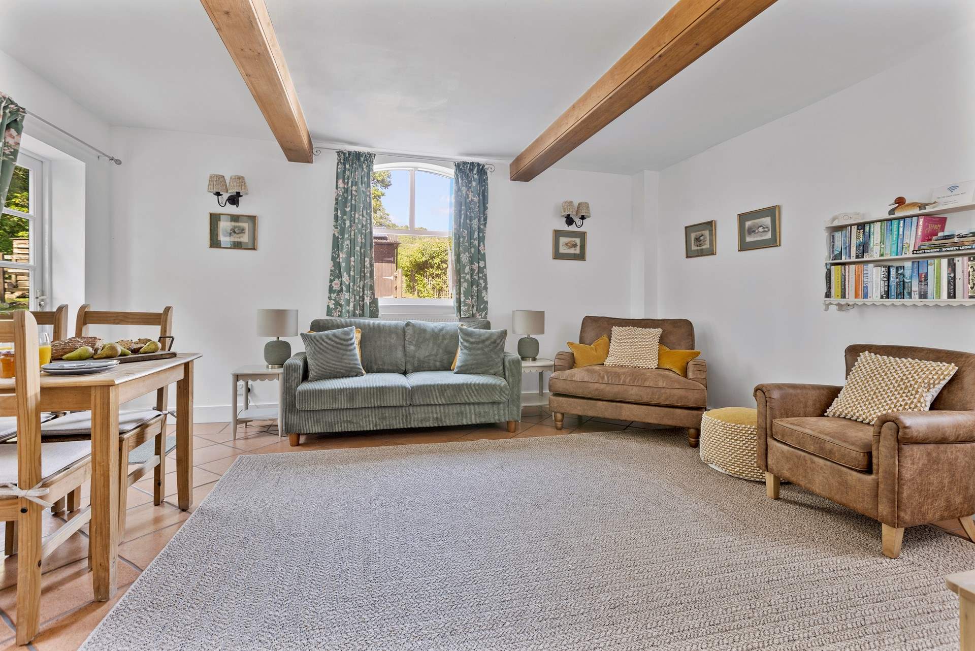 The sitting room is a particularly lovely spot on a sunny day with the door open to the garden...