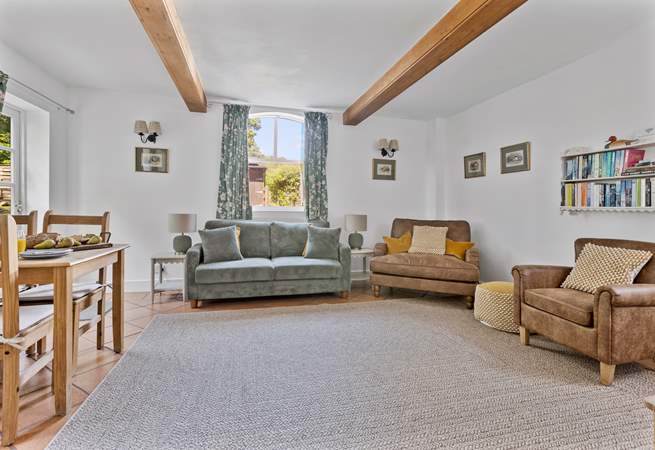 The sitting-room is a particularly lovely spot on a sunny day with the door open to the garden...