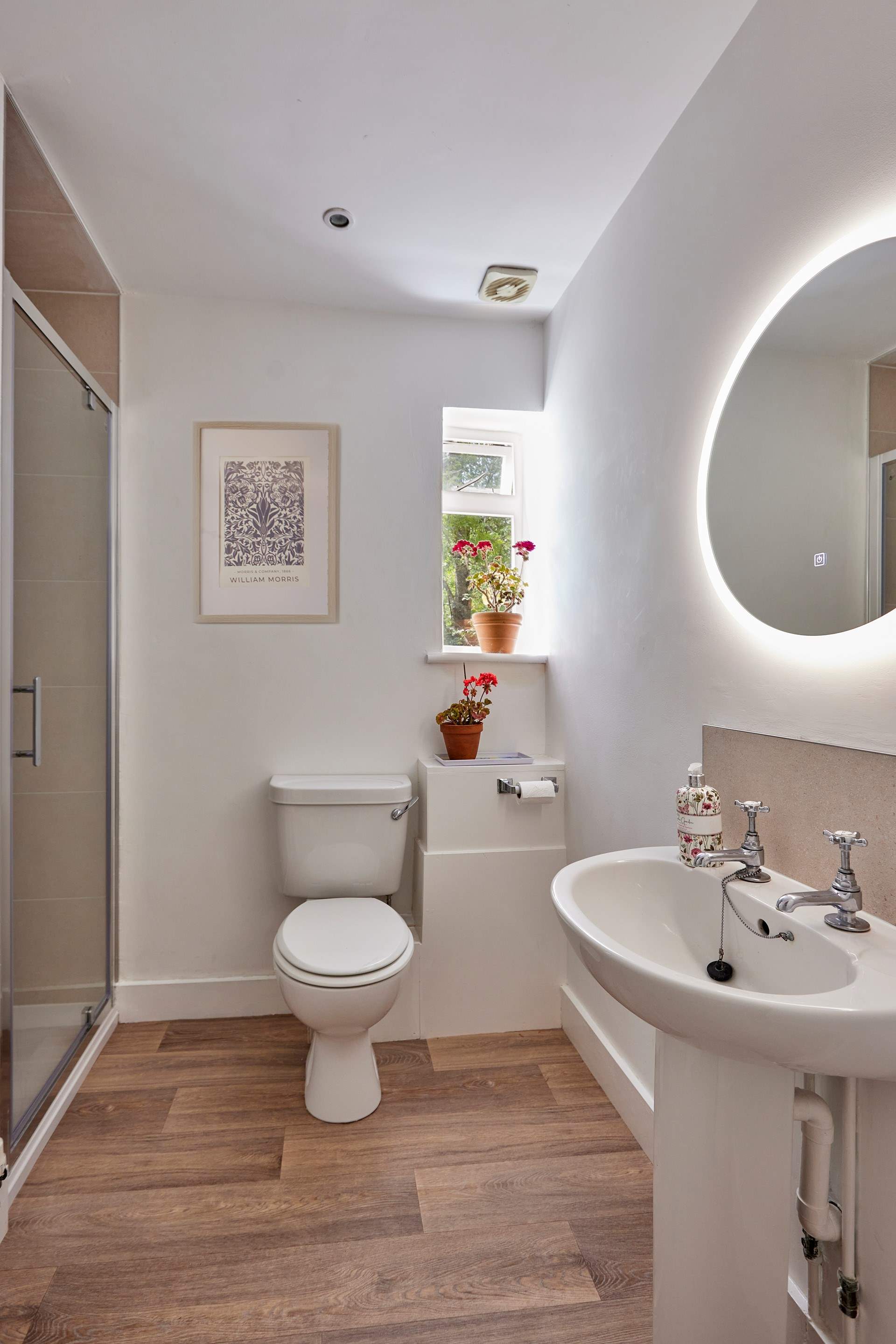 The newly remodelled shower room is sharp and contemporary with a large shower enclosure and anti-mist mirror.