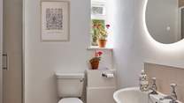 The newly remodelled shower-room is sharp and contemporary with a large shower enclosure and anti-mist mirror.