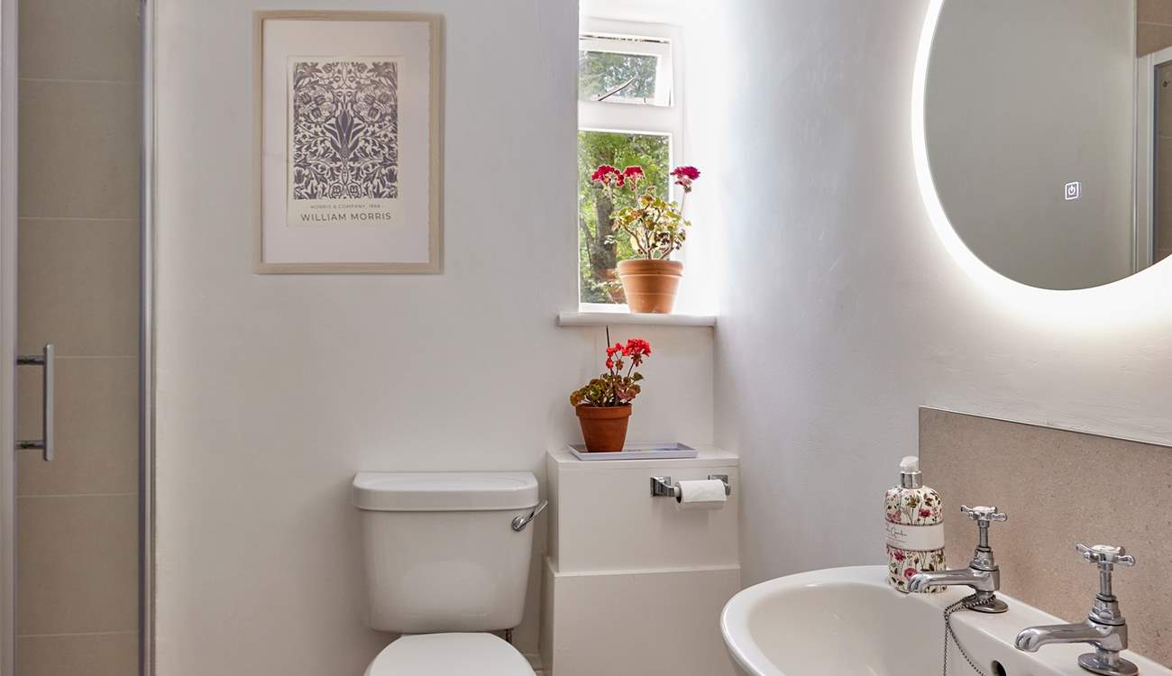 The newly remodelled shower-room is sharp and contemporary with a large shower enclosure and anti-mist mirror.