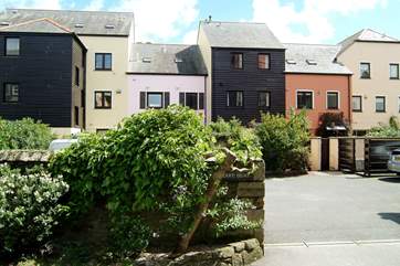 Water's Edge, the tall, dark timbered property in the middle, viewed from the parking-area at the rear.