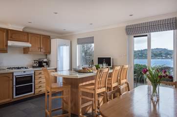 The kitchen/dining-room has doors out to the waterside terrace.