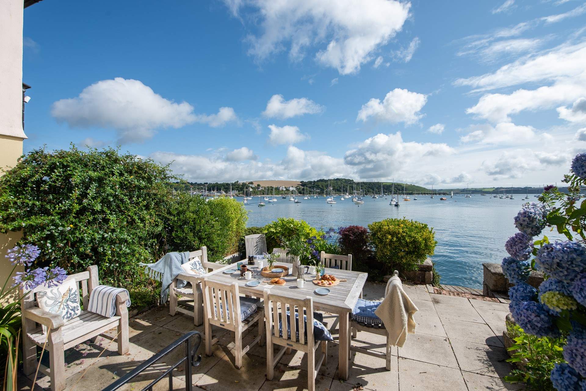 The beautiful balcony is an idyllic spot for breakfast by the water.