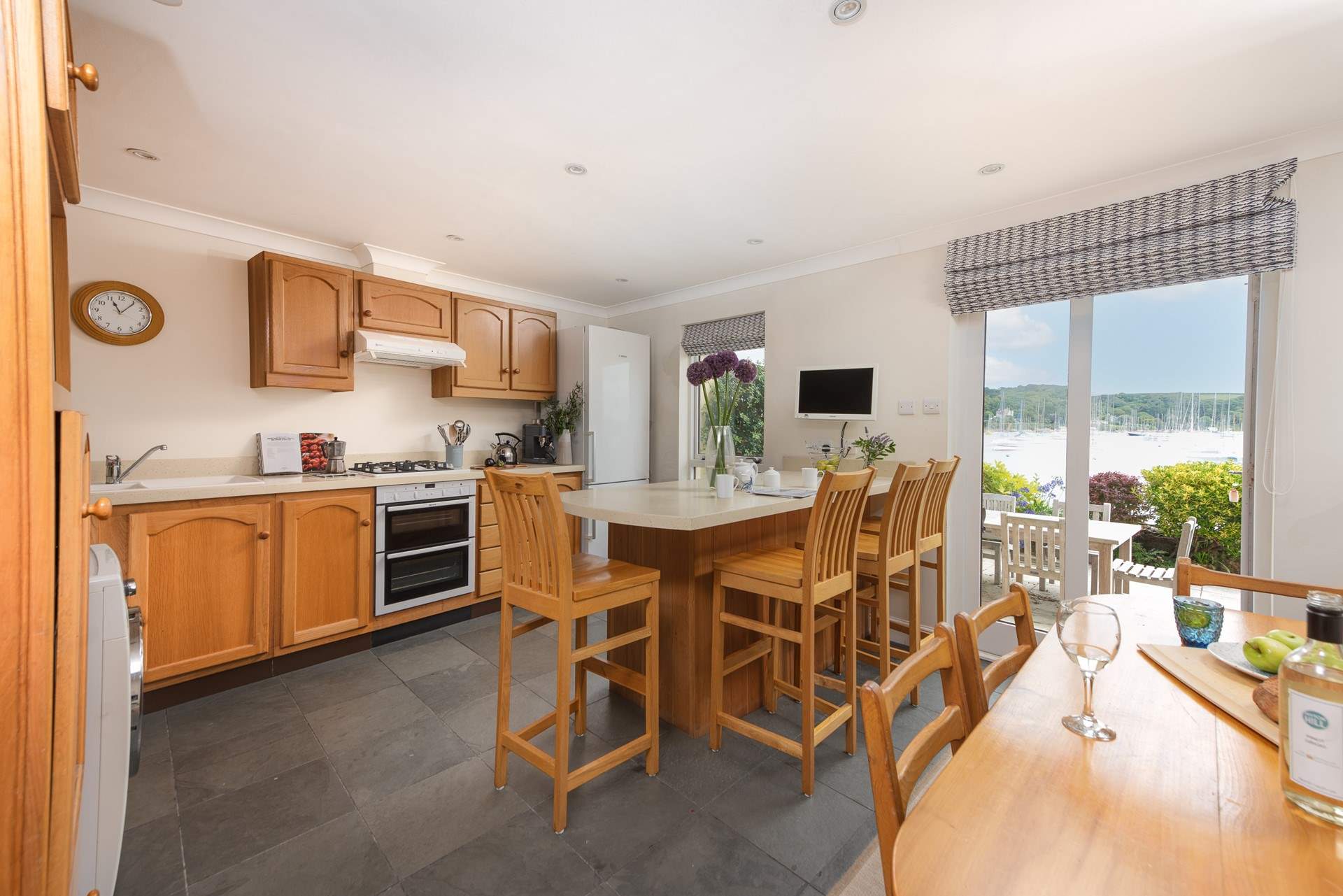 Gorgeous views from the kitchen and the doors open up to the waterside terrace.