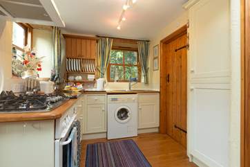 The kitchen has a real home-from-home feel and is very well-equipped. The shower-room is through the door on the right-hand side.