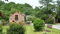 Leat Mill looks out over private fields and woodland and has a gated sun-trap patio in front of the cottage.