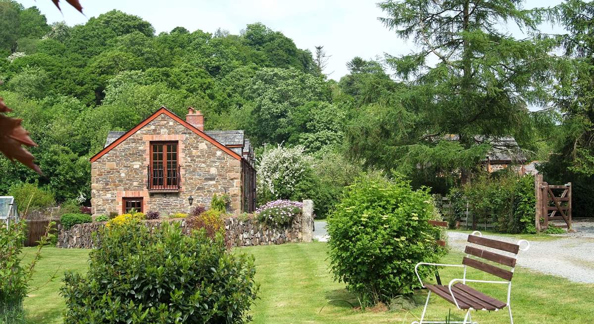 Leat Mill looks out over private fields and woodland and has a gated sun-trap patio in front of the cottage.