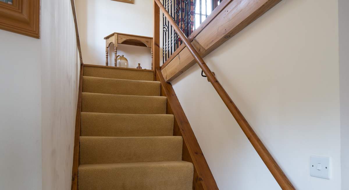 The stairs lead up into the sitting-room.