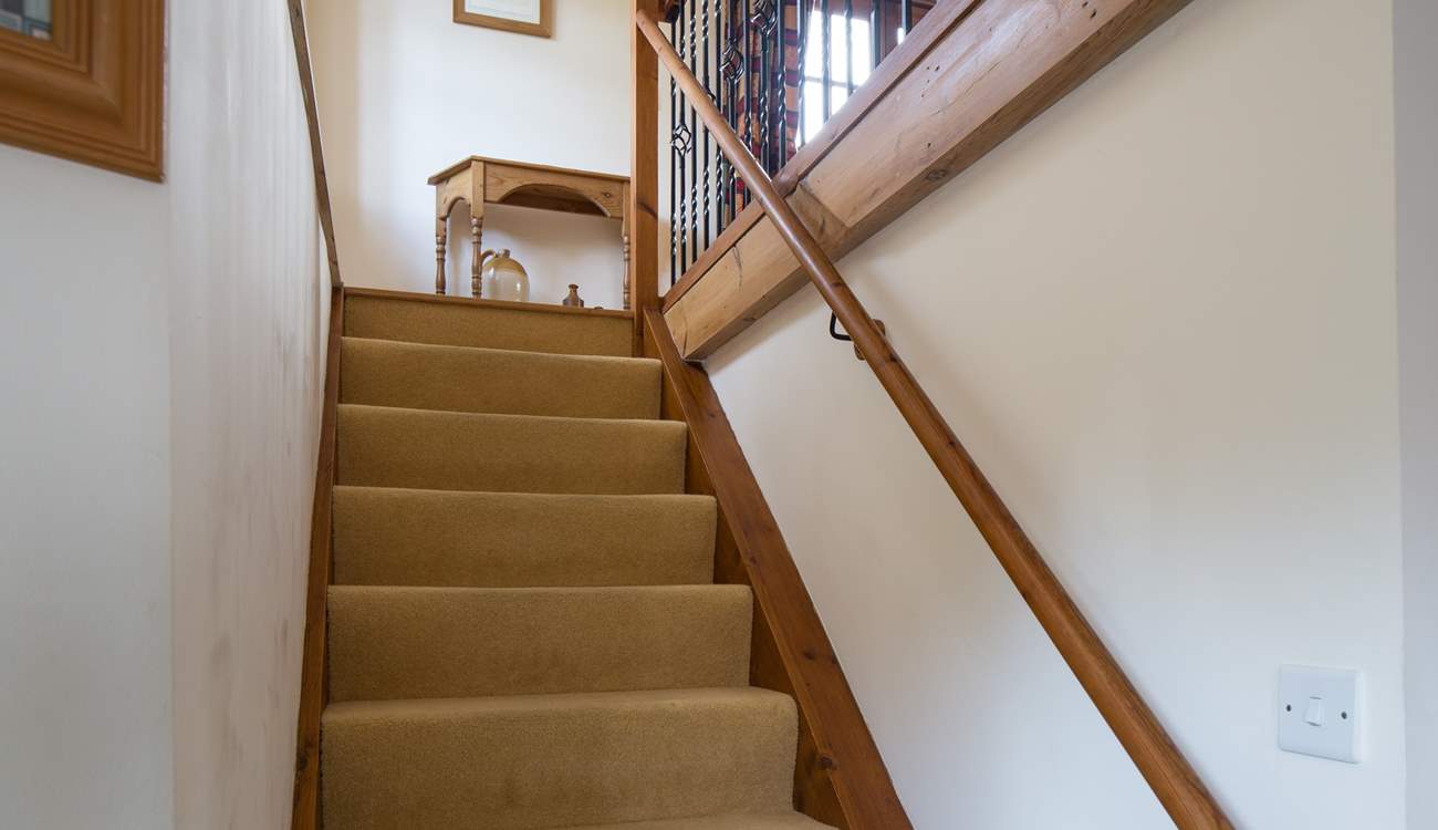 The stairs lead up into the sitting-room.