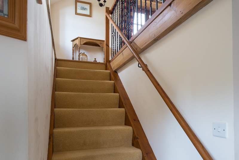 The stairs lead up into the sitting-room.