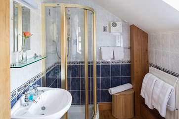 Cheerful blue and white bathroom.