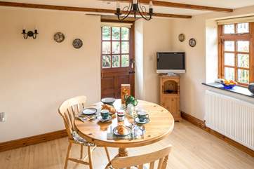 The back door leads out from the dining-area to the sheltered patio.