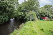 The picnic spot and river is shared with your neighbours.