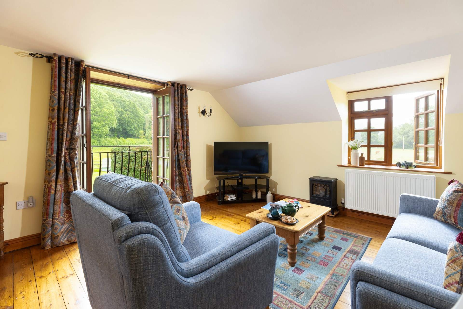 Cuddle up on the sofa to watch a late film on the television.