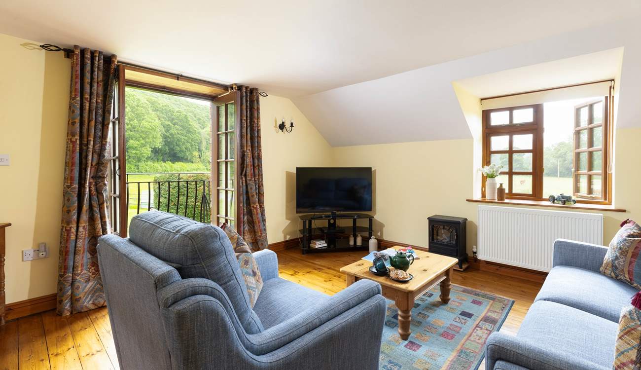 Cuddle up on the sofa to watch a film on the television.