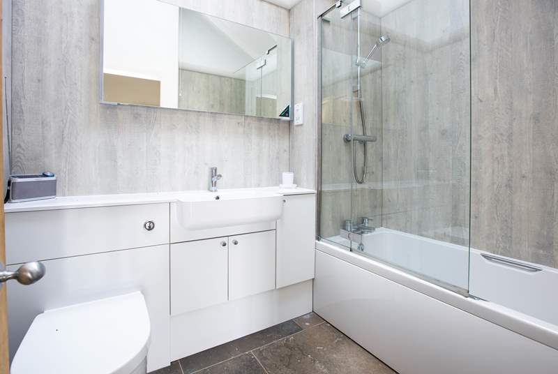 The family bathroom is spacious and light - perhaps enjoy listening to some classical music in the bath?