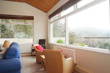 There are superb views across the river from the sitting-room, bedrooms and garden.