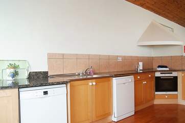 There is plenty of space in the kitchen for preparing family meals.