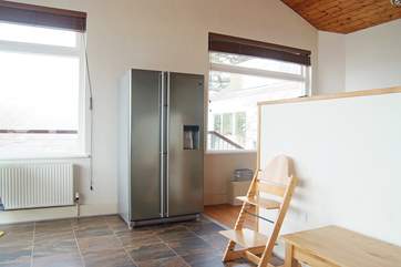 A big fridge/freezer to store all the lovely local produce (the kitchen-area is behind the half wall).