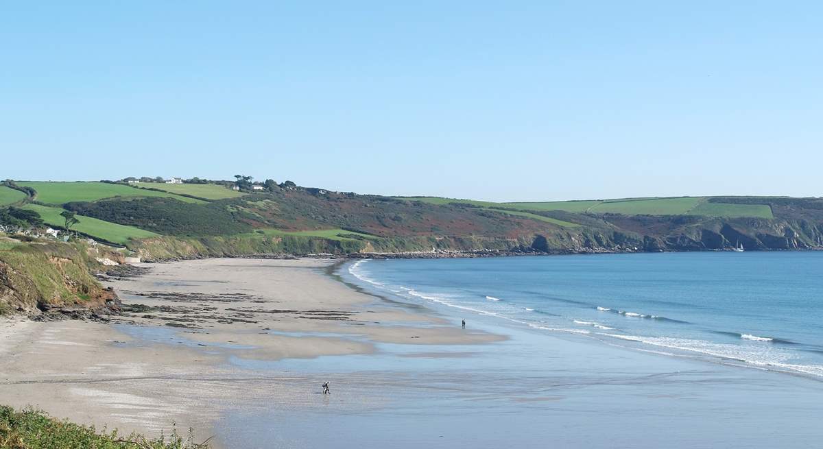 Pendower and Carne beaches join as the tide goes out giving miles of sand to enjoy.