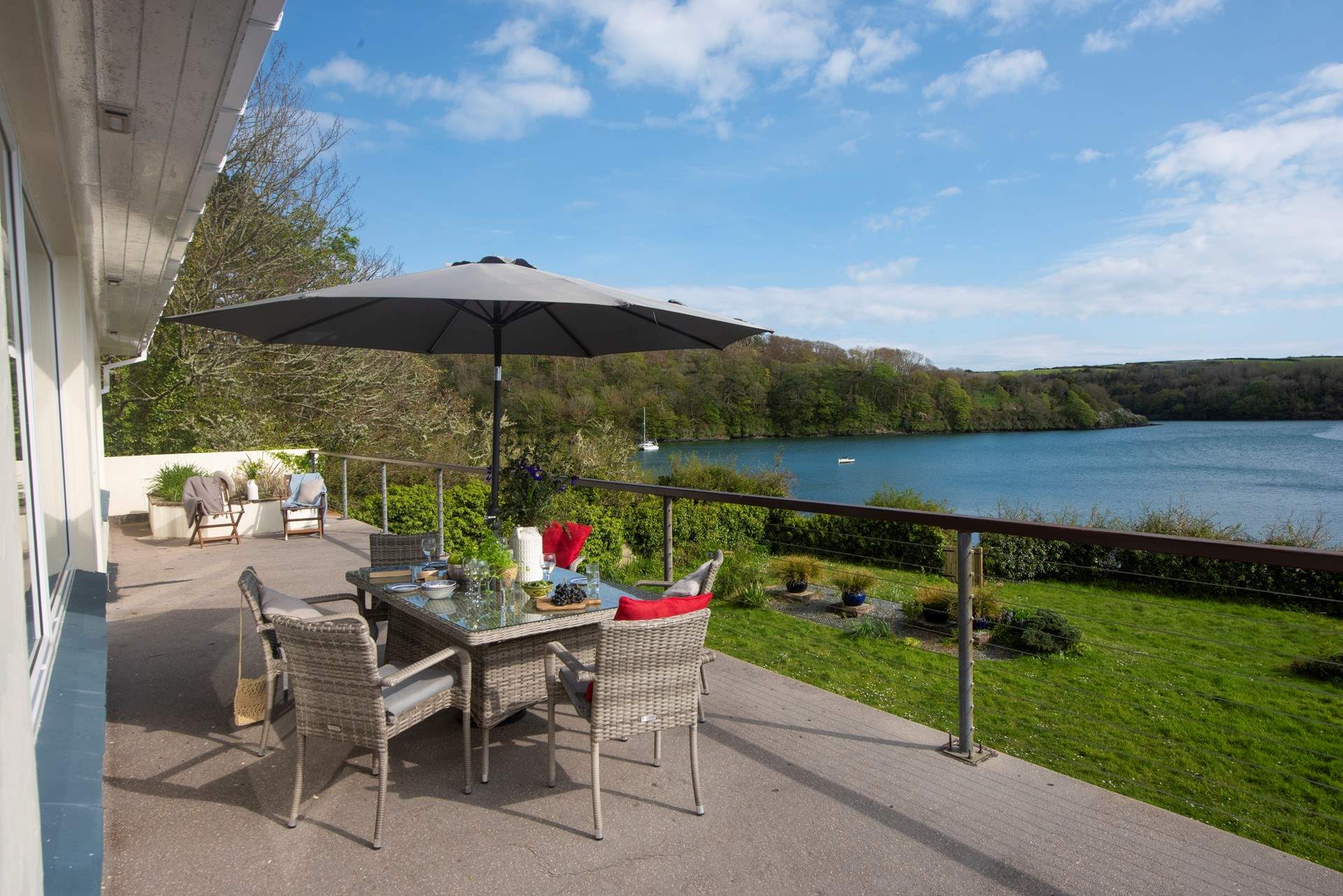 The balcony runs the full length of the front of the house.