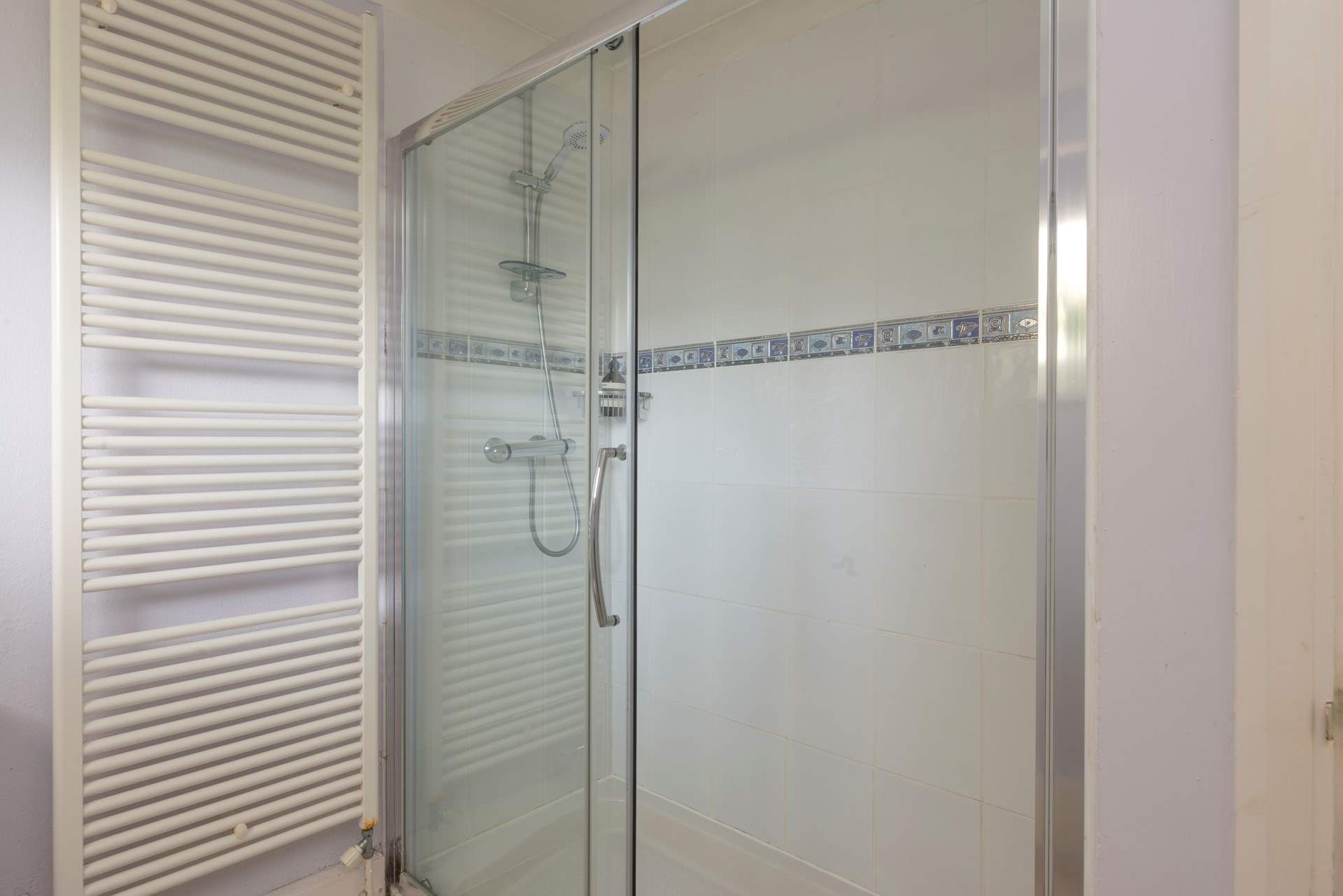 The shower-room on the ground floor has a double shower cubicle.