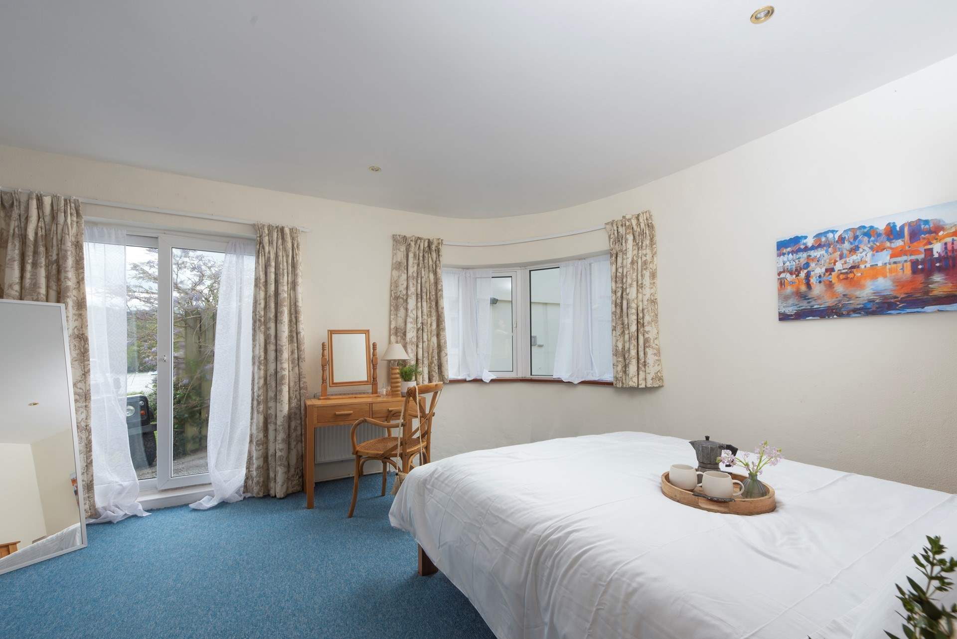 There are doors from Bedroom 1 out to the terrace.