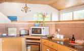 The kitchen-area is well equipped for home cooking. - Thumbnail Image