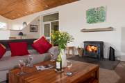 The wood-burner will keep everyone toasty warm whatever the weather outside.