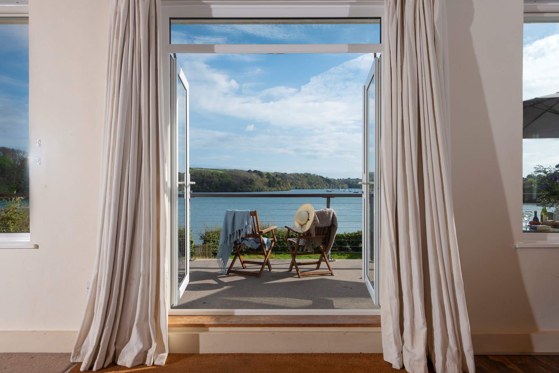 There are superb views across the river from the sitting-room, bedrooms and garden.