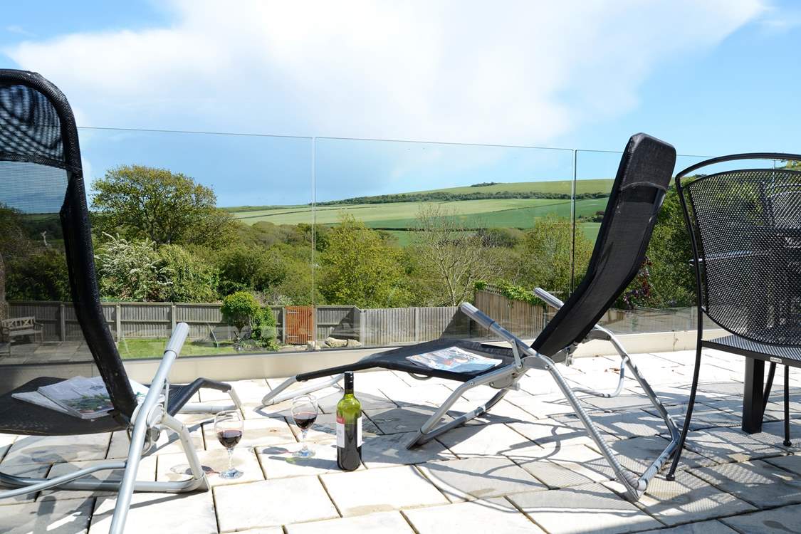 Relax with a glass of wine on the terrace and enjoy the wonderful views over the garden and countryside beyond.