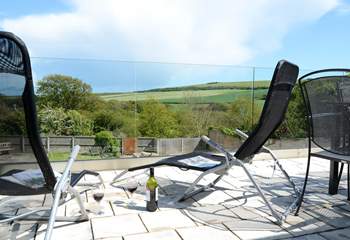 Relax with a glass of wine on the terrace and enjoy the wonderful views over the garden and countryside beyond.