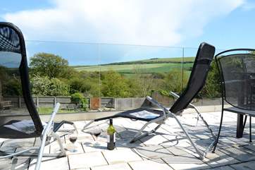 Relax with a glass of wine on the terrace and enjoy the wonderful views over the garden and countryside beyond.