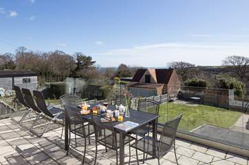 The fabulous terrace has far reaching views of the countryside, with the sea in the distance, on a clear day the Isle of Wight is visible.