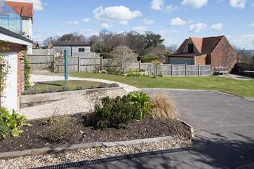 The peaceful back garden, with space for three cars.
