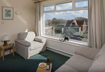 The sitting-room shares the panoramic view of the countryside with the sea beyond and the Isle of Wight on a clear day.