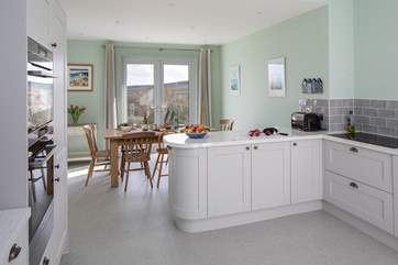 The dining-room has French windows out onto the balcony and magnificent views beyond.