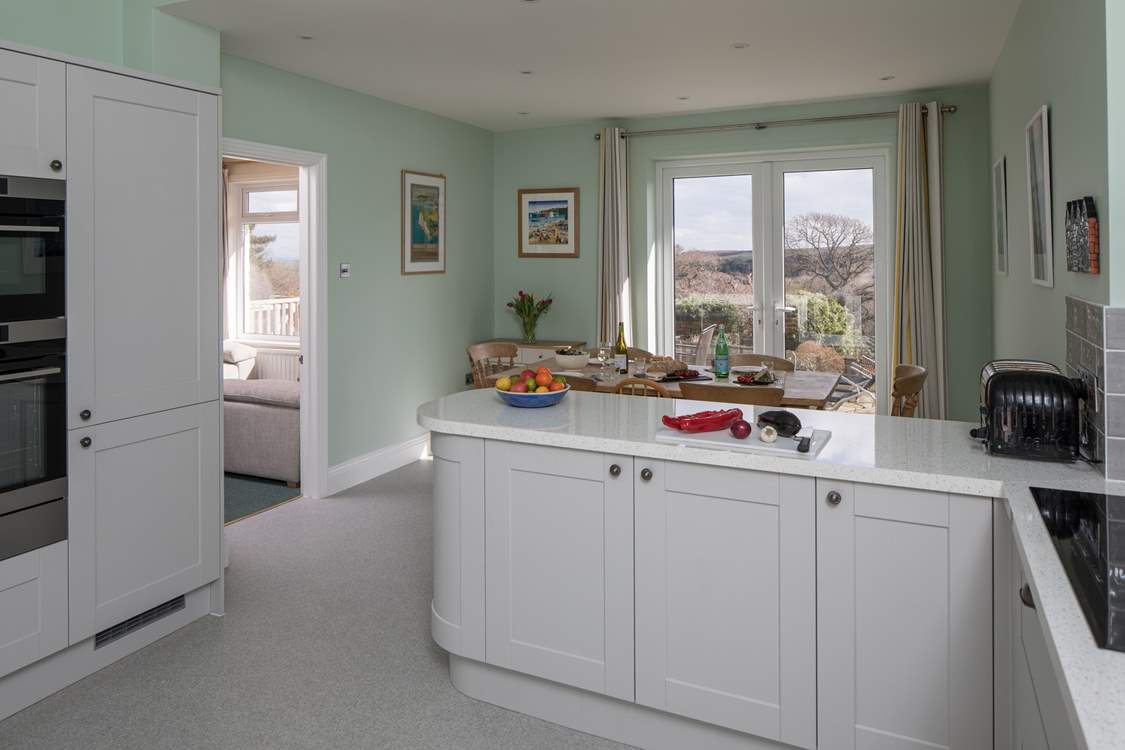 The kitchen has top quality appliances including an induction hob.