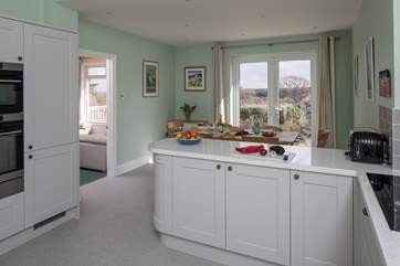 The kitchen has top quality appliances including an induction hob.