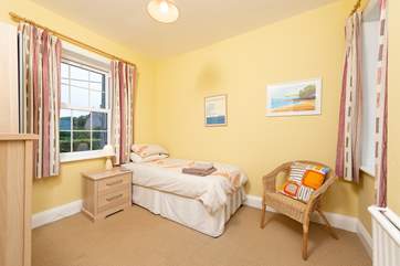 This single room looks out towards the village in one direction and the coast from the other window.