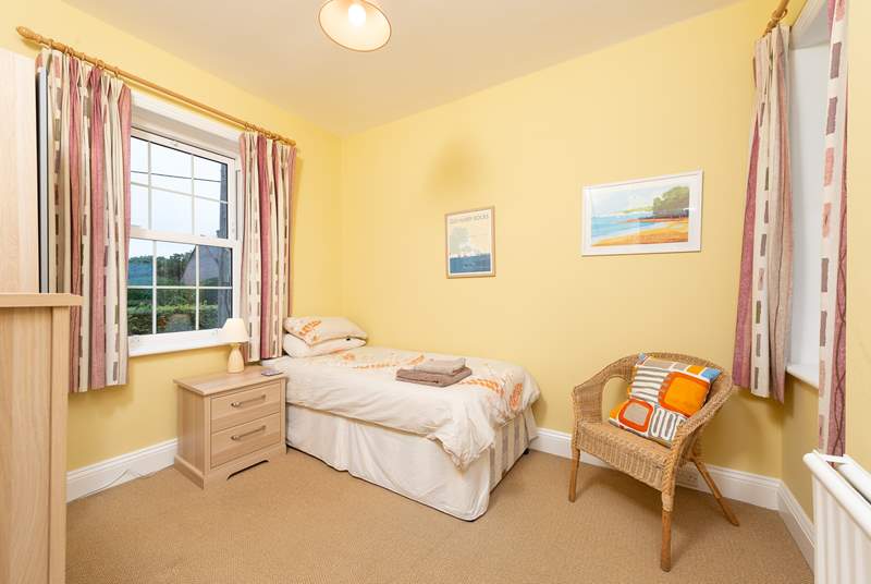 This single room looks out towards the village in one direction and the coast from the other window.