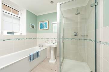 The family bathroom is super flexible with a bath and shower cubicle.